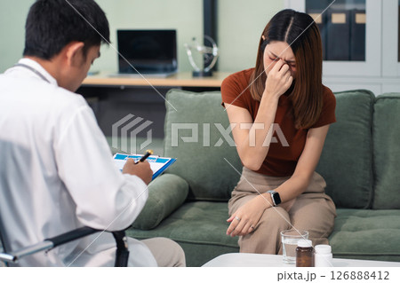 Female patient receiving therapy for depression and stress in a psychiatric clinic. 126888412