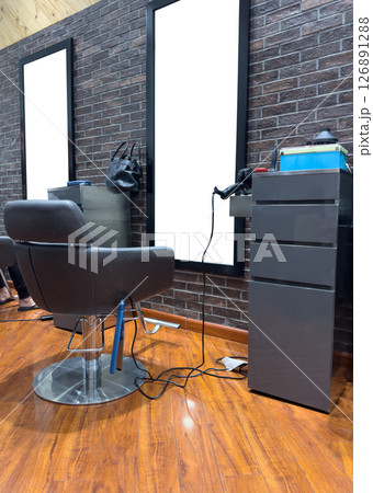 Empty chair in hairdress salon 126891288