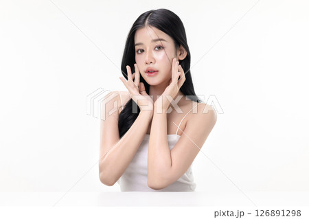 Glowing skin make up style of beautiful young Asian model isolated on white background. Glowing skin make up style of beautiful young Asian model isolated on white background. 126891298