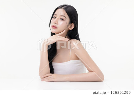 Glowing skin make up style of beautiful young Asian model isolated on white background. Glowing skin make up style of beautiful young Asian model isolated on white background. 126891299