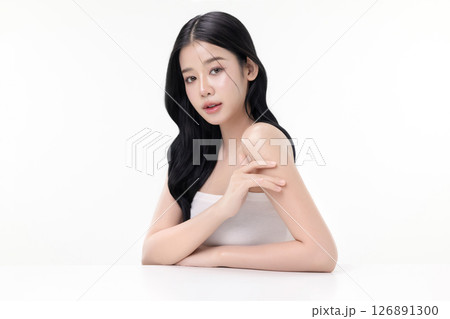 Glowing skin make up style of beautiful young Asian model isolated on white background. Glowing skin make up style of beautiful young Asian model isolated on white background. 126891300