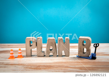 Plan B. Concrete Alphabet Letters on a White Wooden and Blue Background 126892121