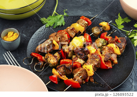 Skewers with grilled meat and vegetables. 126893522