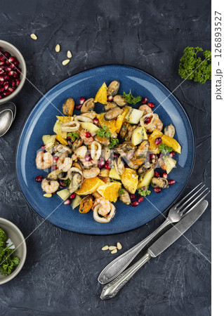 Plate of delicious fruit salad with seafood. 126893527