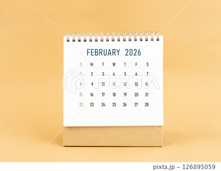 February 2026 desk calendar on yellow background, Front view. 126895059
