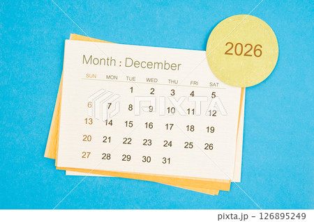 December 2026 calendar page on blue background. 126895249