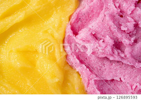 Strawberry and melon fruit scrub texture. Bright pink and yellow creamy smear with exfoliating crystals. Organic cosmetic body care peeling. Natural skincare exfoliating scrubber treatment. 126895593