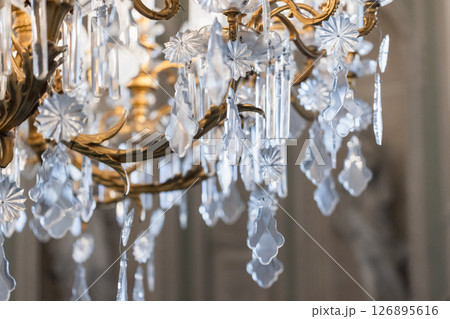 A luxurious chandelier showcasing intricate crystal ornaments A luxurious chandelier showcasing intricate crystal ornaments 126895616