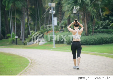 Asian woman jogger running in green nature public park, active lifestyle, fitness, outdoor exercise, healthy, peaceful mood Asian woman jogger running in green nature public park, active lifestyle, fitness, outdoor exercise, healthy, peaceful mood 126896912