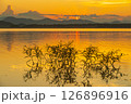Landscape of mountains and lake at sunset and clouds reflected in the water. 126896916