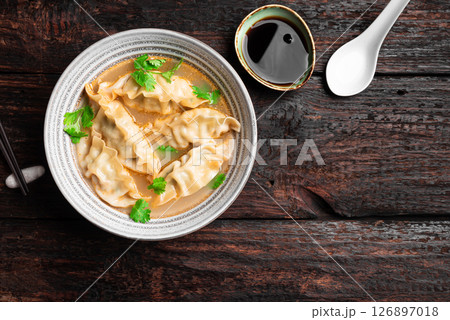 Wonton soup. Asian dumpling soup. Wonton soup. Asian dumpling soup. 126897018
