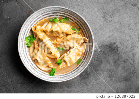 Wonton soup. Asian dumpling soup. Wonton soup. Asian dumpling soup. 126897022