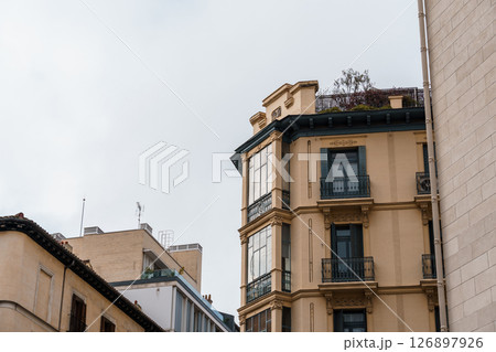 Classic architecture defines Madrid's real estate with its elegant residential buildings. 126897926