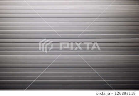 Corrugated metal sheet creating a striped metallic background Corrugated metal sheet creating a striped metallic background 126898119