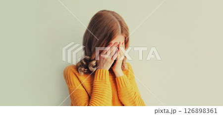 Upset sad crying woman while experiencing mental suffering, depression, fatigue, emotional stress Upset sad crying woman while experiencing mental suffering, depression, fatigue, emotional stress 126898361