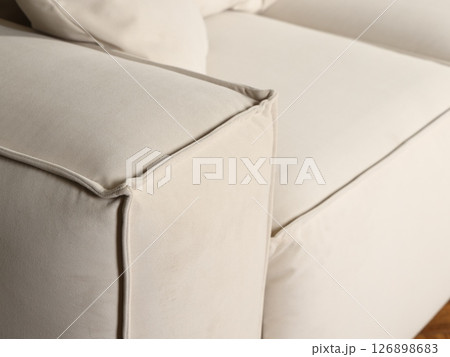 The Elegant White Sofa with a corner detail adds a touch of class to any interior space 126898683