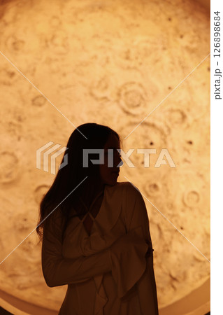 A Stunning Silhouette Set Against a Beautiful Celestial Background for Artistic Expression A Stunning Silhouette Set Against a Beautiful Celestial Background for Artistic Expression 126898684