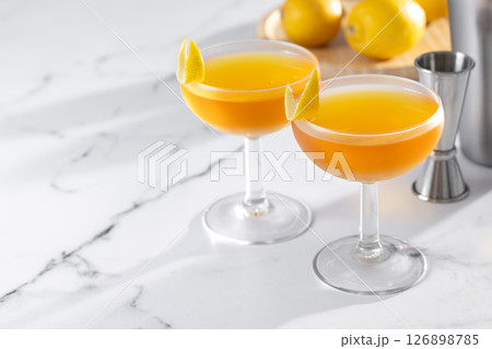 Paper plane cocktail on white marble. Copy space 126898785