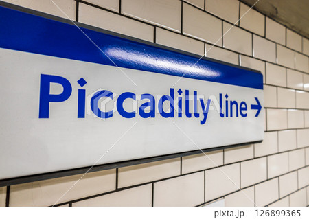 Piccadilly Line Sign on London Underground Metro Station Wall 126899365