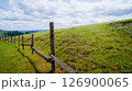 Wooden fence with barbed wire in the mountains 126900065
