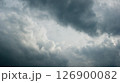 Gray contrasting fluffy storm clouds 126900082