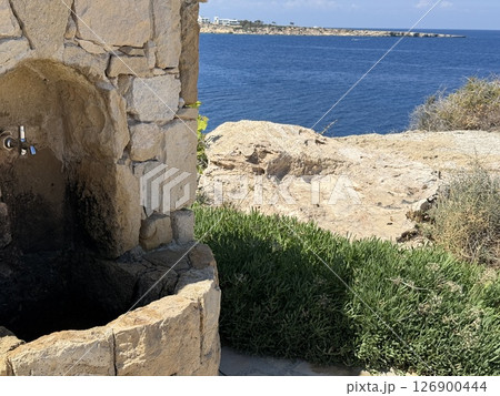 Picturesque beach, waves crashing on the sandy shore. Sea waves beat against the rocks. Cyprus Island, Mediterranean Sea. Picturesque beach, waves crashing on the sandy shore. Sea waves beat against the rocks. Cyprus Island, Mediterranean Sea. 126900444