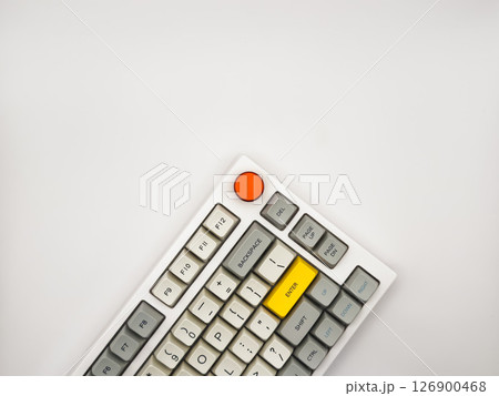 White keyboard on white background with bright red and yellow keys for advertising, space for text, top view 126900468
