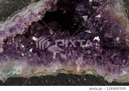 Amethyst Crystal Druse macro mineral on white background Amethyst Crystal Druse macro mineral on white background 126900509