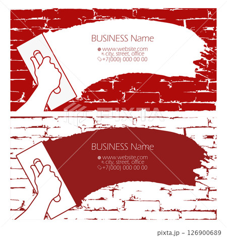 Spatula in hand spreads plaster on brick wall. Business card plasterer concept Spatula in hand spreads plaster on brick wall. Business card plasterer concept 126900689