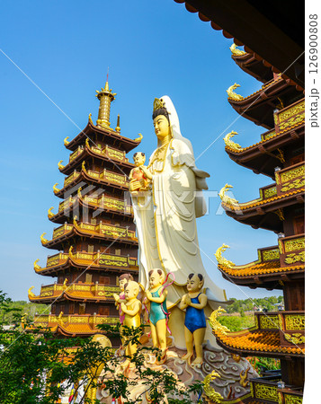 Statue of Lady Buddha with children at the Chua Thien Quang Pagoda in Mui Ne City, Vietnam Statue of Lady Buddha with children at the Chua Thien Quang Pagoda in Mui Ne City, Vietnam 126900808