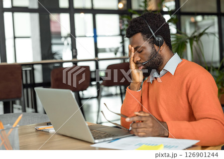 African american entrepreneur looking tired after hours of overtime African american entrepreneur looking tired after hours of overtime 126901244