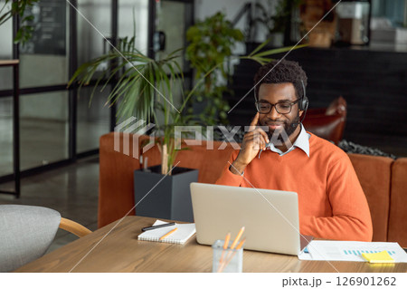 African american lawyer having a video call with the client and looking busy 126901262