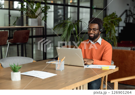 African american lawyer having a video call with the client and looking busy 126901264