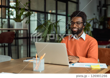 African american lawyer having a video call with the client and looking busy 126901266