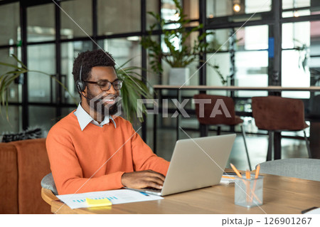 African american lawyer having a video call with the client and looking busy 126901267
