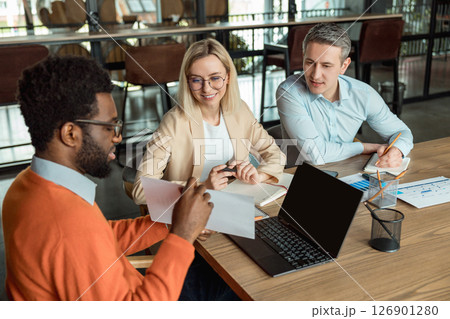 Group of business consultants looking involved while discussing a new case 126901280