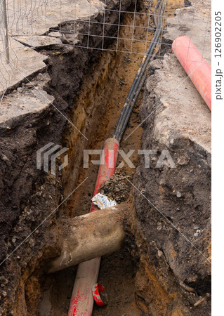 Repair of sewage heating systems or electricity. A trench has been dug in the ground. Repair of sewage heating systems or electricity. A trench has been dug in the ground. 126902205