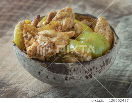 Homemade Stir fried Chicken and curry paste with Thai eggplant, Kaempfer in Coconut bowl. Homemade Stir fried Chicken and curry paste with Thai eggplant, Kaempfer in Coconut bowl. 126902457