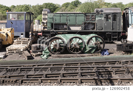 Train carriages and parts awaiting reassembly or are undergoing repairs on rail yards of the Tunbridge Wells railway station. Train carriages and parts awaiting reassembly or are undergoing repairs on rail yards of the Tunbridge Wells railway station. 126902458