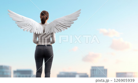 Woman with angel wings overlooking a city skyline. 126905939