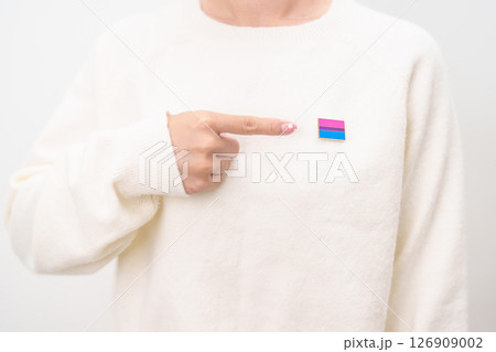 Bisexuality Celebrate Day and LGBT pride month, LGBTQ or LGBTQIA concept. Hand holding purple, pink and blue flag shape for Lesbian, Gay, Bisexual, Transgender, Queer, Pansexual, Marriage Equality Law Bisexuality Celebrate Day and LGBT pride month, LGBTQ or LGBTQIA concept. Hand holding purple, pink and blue flag shape for Lesbian, Gay, Bisexual, Transgender, Queer, Pansexual, Marriage Equality Law 126909002