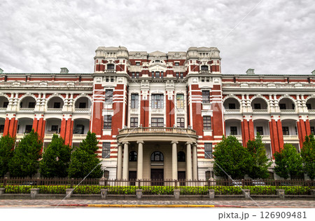 Taiwan Presidential Office Building in Taipei Zhongzheng District displays a grand Baroque-revival facade with striped pilasters, arched loggias, and a colonnaded portico, framed by manicured trees Taiwan Presidential Office Building in Taipei Zhongzheng District displays a grand Baroque-revival facade with striped pilasters, arched loggias, and a colonnaded portico, framed by manicured trees 126909481