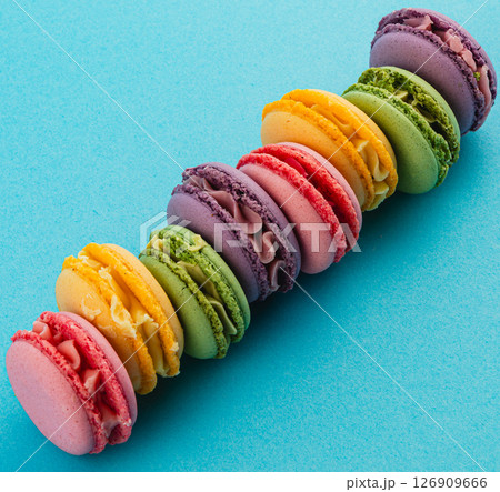 Colorful macaron display on a blue background 126909666