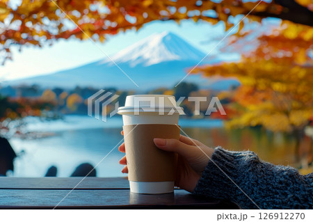 a woman with A cup of coffee on a table enjoying in mountain Fuji view in bright day overlooking an autumn view. Generative AI. 126912270