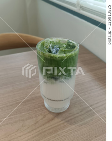 top view matcha green tea in a clear glass on a table background, drink, health, fresh, cool, copy space top view matcha green tea in a clear glass on a table background, drink, health, fresh, cool, copy space 126913825