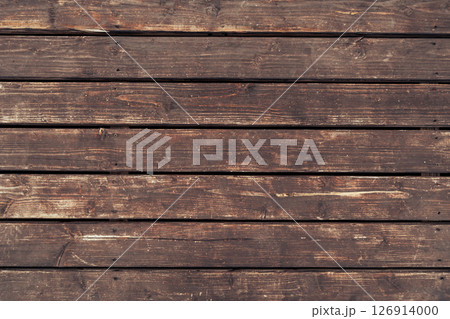 Aged wooden planks with rough texture and natural imperfections 126914000