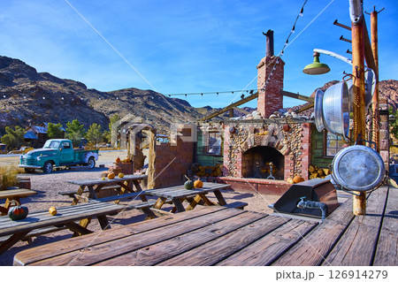 Vintage Turquoise Stone Fireplace in Rustic Desert Setting Eye-Level View Vintage Turquoise Stone Fireplace in Rustic Desert Setting Eye-Level View 126914279