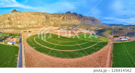 Aerial Lush Circular Farmland Red Rock Desert and Rural Road Panorama Fly Through Aerial Lush Circular Farmland Red Rock Desert and Rural Road Panorama Fly Through 126914562