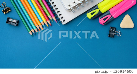 Bright school supplies on a blue background Bright school supplies on a blue background 126914600
