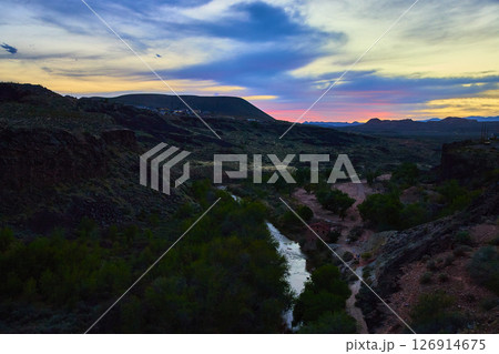 Desert Canyon River Sunset with Lush Trees and Cabin Aerial Fly Through 126914675